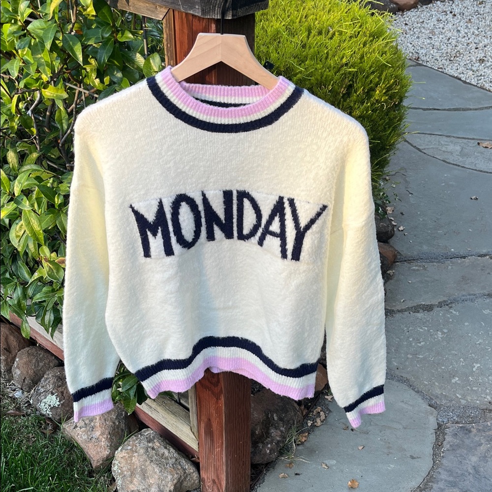 Chic Cream Sweater with Black and Pink Details